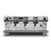 A large, stainless steel Rancilio Invicta commercial espresso machine with 3 group heads, digital displays, steam wands, and portafilters, viewed from the front against a white background. © 2025 1st-line.com