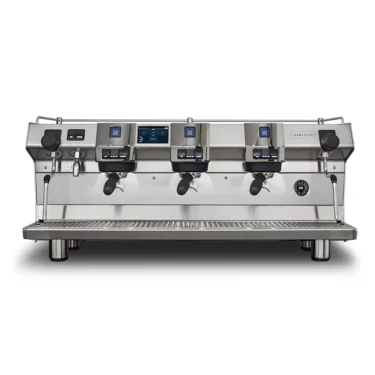 A large, stainless steel Rancilio Invicta commercial espresso machine with 3 group heads, digital displays, steam wands, and portafilters, viewed from the front against a white background. © 2025 1st-line.com