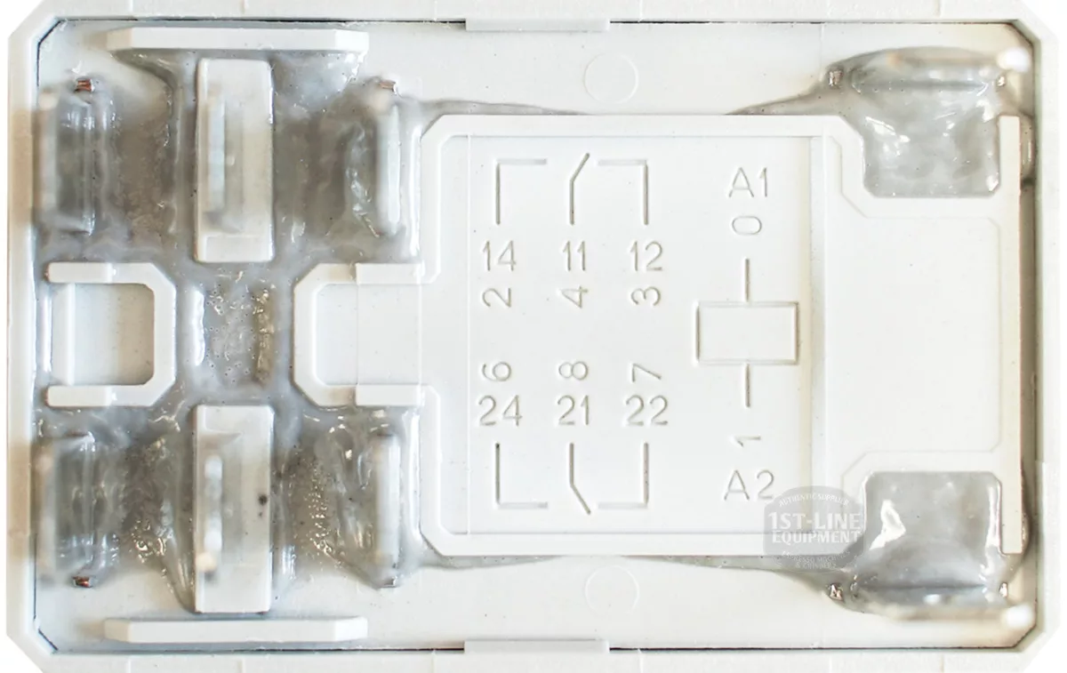 Close-up of a Bezzera 7635422 Finder Relay base with numbered pin slots labeled A1 and A2, metallic contacts on the left, and a white surface featuring gray details and labeling. © 2025 1st-line.com