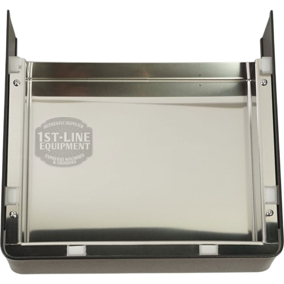 The Lelit 1000246 Black Drip Tray MaraX is a shiny, rectangular stainless steel drip tray with black side supports and clear rubber corner stoppers for the Lelit MaraX. It features a 1st-Line Equipment logo on the back panel. © 2025 1st-line.com