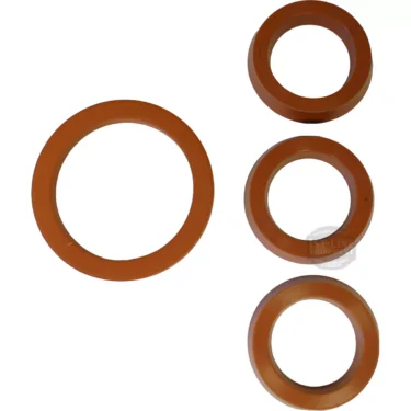 The Ponte Vecchio Grouphead and Piston Gasket Kit includes four brown rubber washers of various sizes, displayed on a white background, with the Grouphead Gasket and three smaller Piston Gaskets arranged side by side. © 2025 1st-line.com