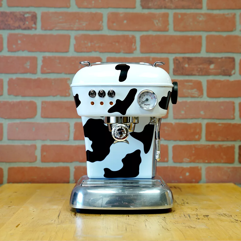 The SIDEWALK SALE - Ascaso Dream (Cow) UP V2 Espresso Machine (E011) features a bold cow print design—making it a standout piece for any display. © 2025 1st-line.com