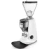 A modern white espresso coffee grinder with a large transparent bean hopper, digital display, and grinding chute stands on a black base against a plain background. © 2025 1st-line.com