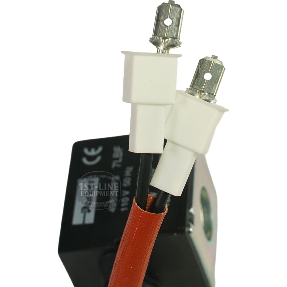 Close-up of two white electrical connectors with metal prongs attached to black wires, partially covered by a red sheath, connected to the Elektra 06603059 Grouphead Wired Coil in the background. © 2025 1st-line.com