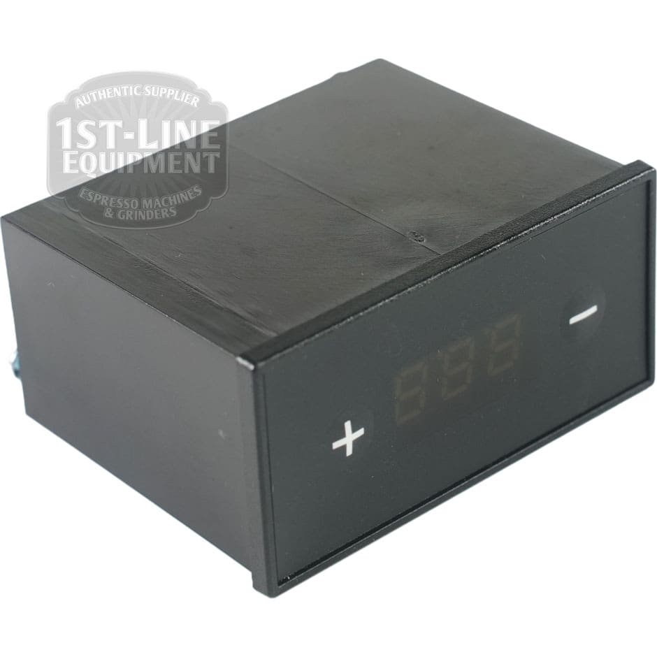 The Rancilio 10701630 Display Assembly - Silvia Pro is a black digital control panel with a screen and plus/minus touch buttons on the front, featuring the 1st-Line Equipment watermark in the upper left corner. © 2025 1st-line.com