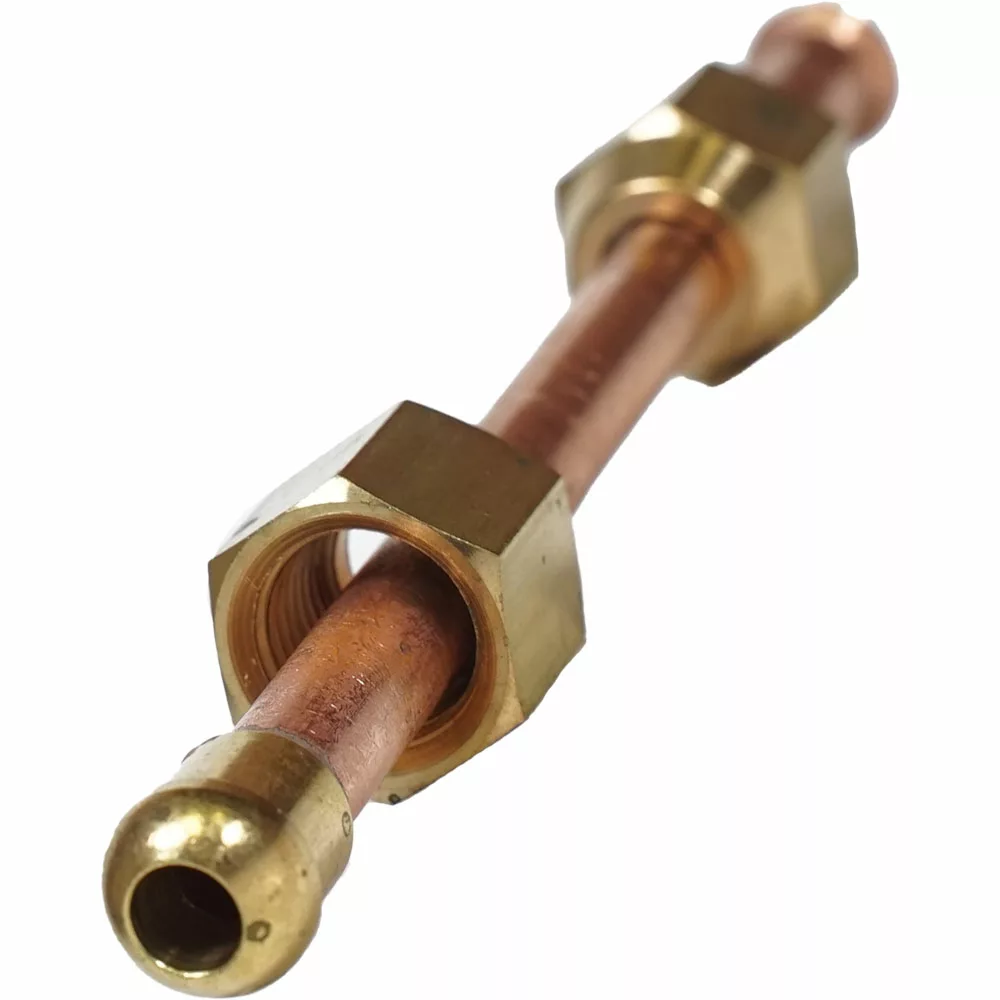 A close-up shows the VBM TUBIP993 Tube Connection from Boiler to Steam Valve: a copper pipe with two brass compression nuts, positioned diagonally with the foreground nut clearly visible. © 2025 1st-line.com
