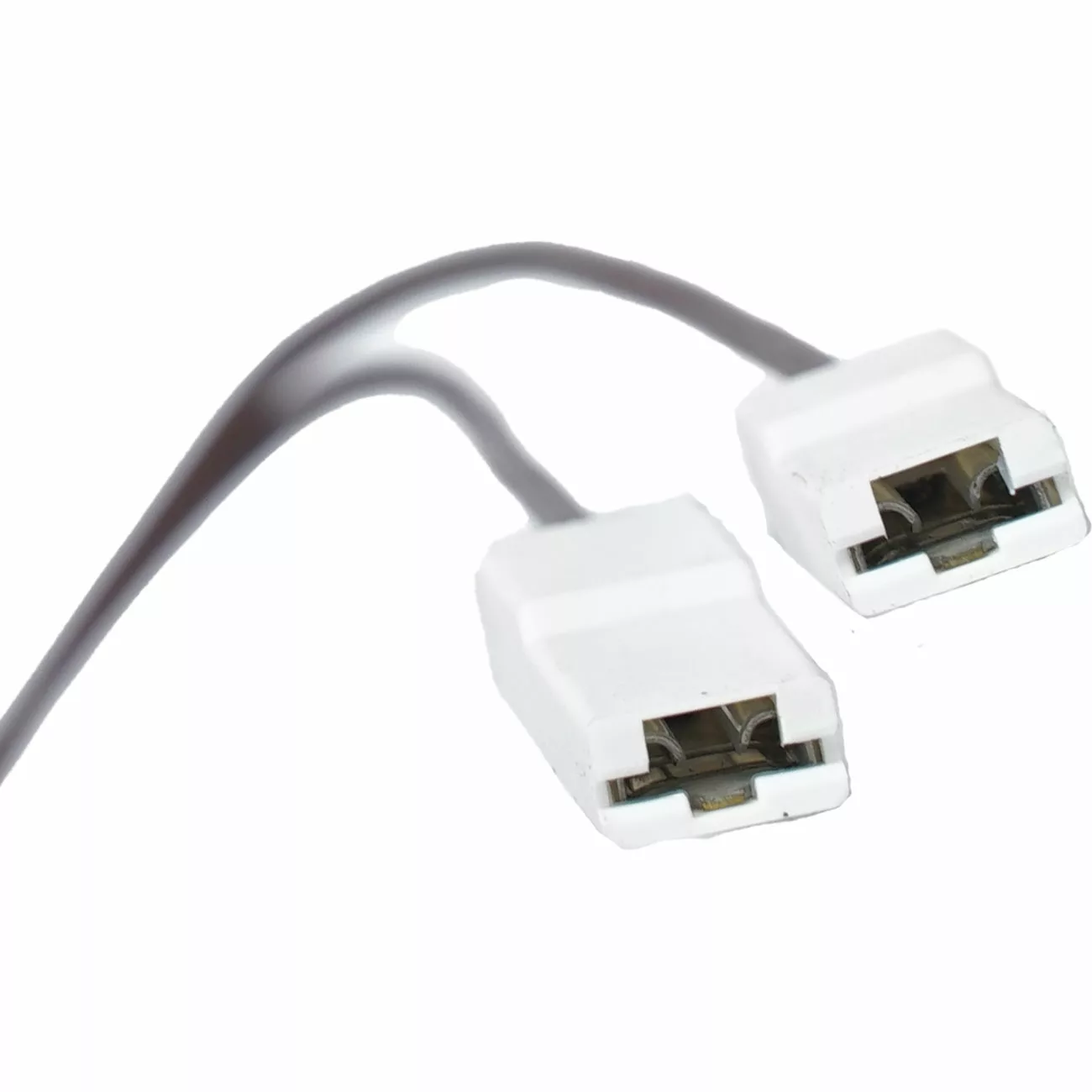 Two white electrical connectors with black wires, side by side on a plain white background, compatible with the Bezzera 5963306 Cartridge Heating Element 110V 100W. © 2025 1st-line.com