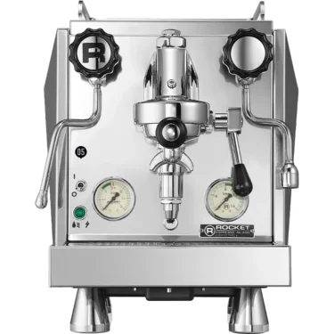 Front view of the Rocket Giotto Evoluzione R HX Espresso Machine, featuring two large black knobs, dual pressure gauges, a steam wand, and hot water spout. The stainless steel finish gives it a sleek, modern appearance.