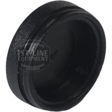 A close-up of the ACS MIN0072 Minima Plastic End Cover/Cap for Steam Wand Valve, black and round with a textured finish, photographed against a white background, designed to seal or cover the end of steam wand valves. © 2025 1st-line.com