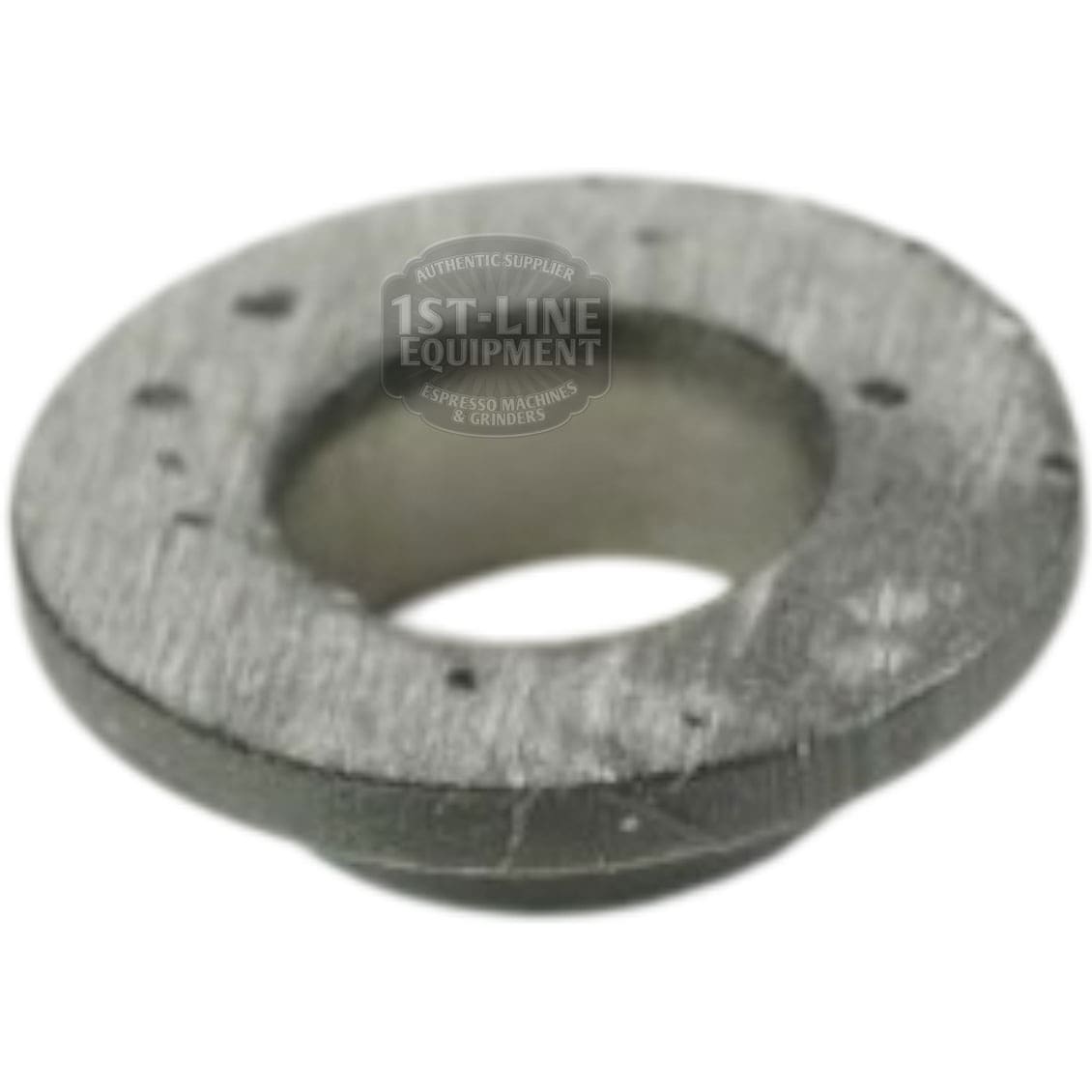 A close-up of the VBM BOCCOLANYLON Side Panel Screw Holder, a metallic circular washer with a large central hole and several smaller holes, featuring a slightly rough texture, displayed on a white background. © 2025 1st-line.com