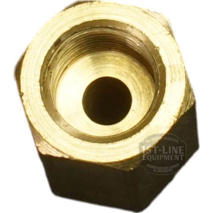 Close-up of the Bezzera 5302085 Fitting 1/8GF x 1/8GC, a brass hexagonal connector with a threaded inner hole, viewed from above. Its commonly used as an adapter in plumbing or machinery applications. © 2025 1st-line.com