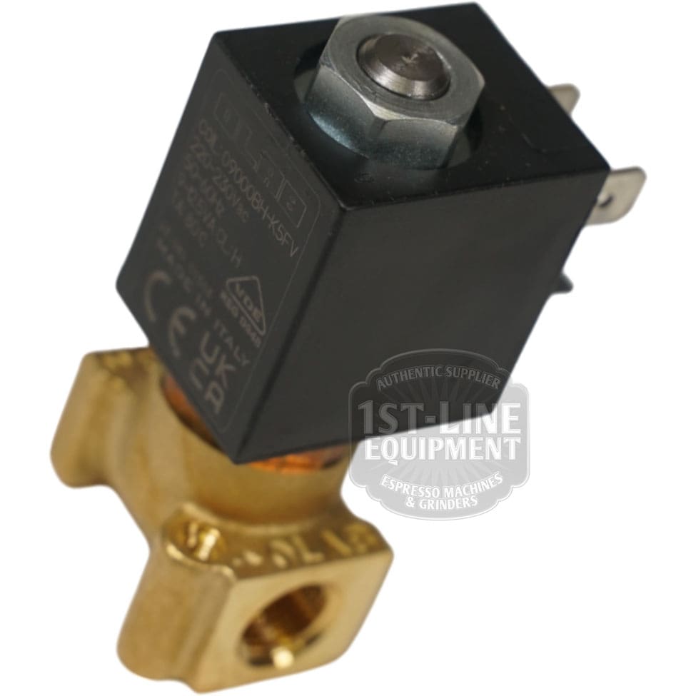 Close-up of the OLAB Solenoid Valve 2-Ways 230 Volt, featuring a brass and black finish with electrical connectors and certification markings, commonly used in espresso machines and grinders. © 2025 1st-line.com