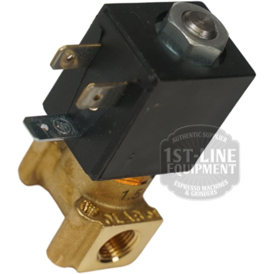 Close-up of the OLAB Solenoid Valve 2-Ways 230 Volt with a black coil on top, two metal prongs, and bottom threading for connection, shown in front of the partially visible 1st-Line Equipment logo. © 2025 1st-line.com