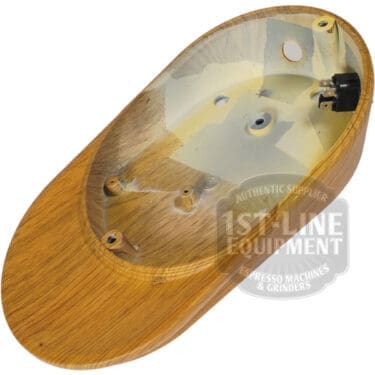 The Quamar 160435 Wood Effect Bottom is a smooth, empty wooden espresso machine base with mounting holes and internal electrical connection, shown from above to reveal its internal structure. © 2025 1st-line.com