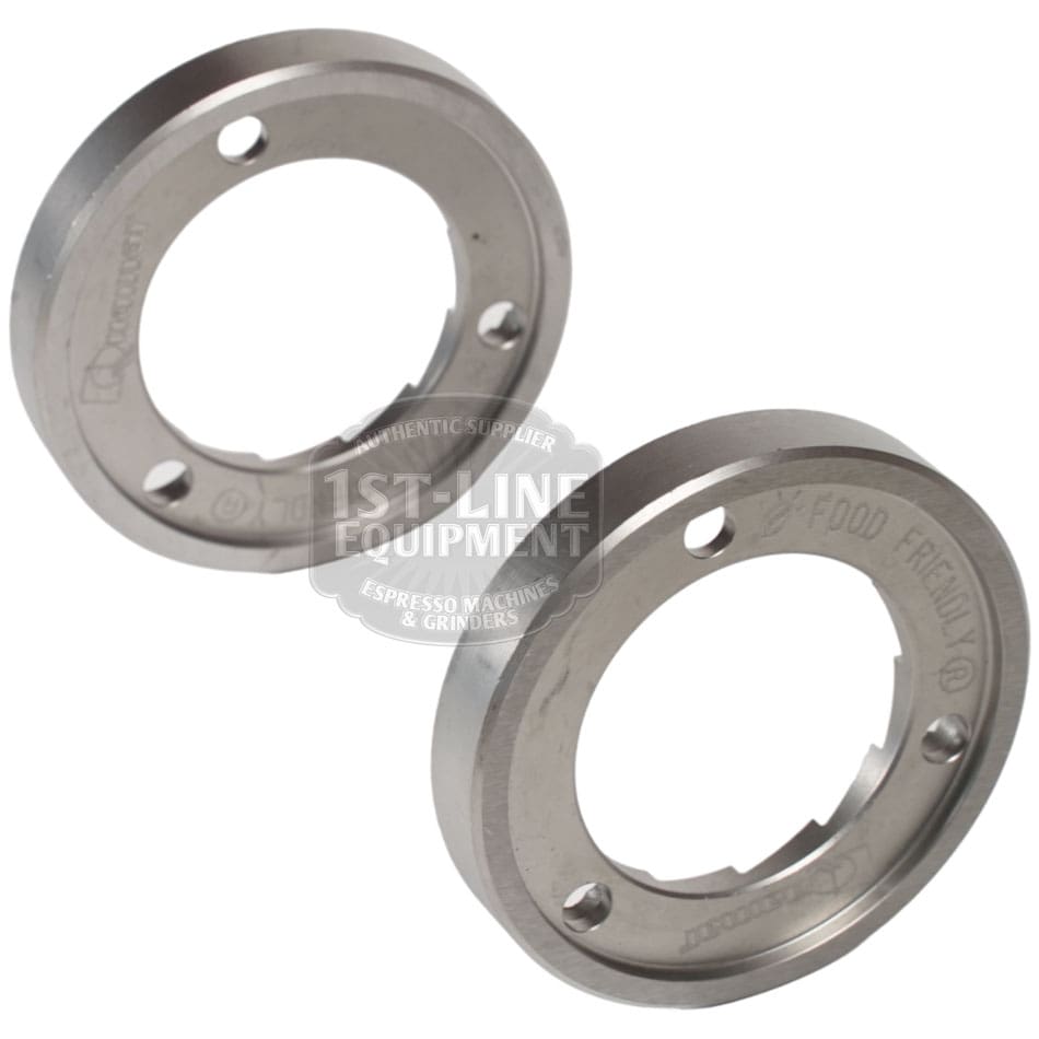 The Quamar 260015 63 mm Grinding Burrs set of 2 features circular, engraved replacement parts with inner notches and screw holes for espresso grinders, displayed from various angles on a white background. © 2025 1st-line.com