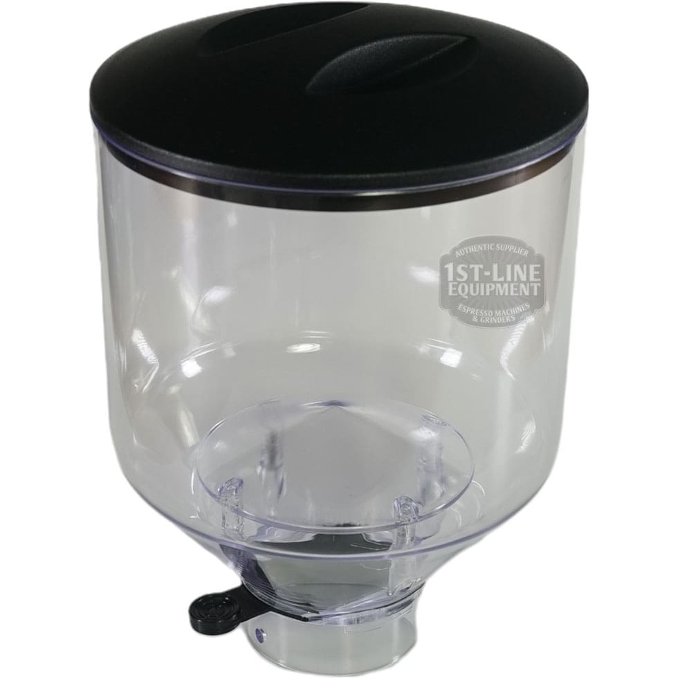 The Quamar RMT800015 1.2 kg Bean Hopper Assembly features a clear plastic body with a black lid, bottom spout, and 1st-Line Equipment logo. © 2025 1st-line.com