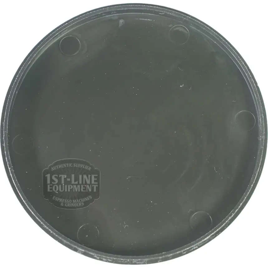 This black, round plastic tamper mat for espresso machines features the white 1st-Line Equipment logo and pairs perfectly with Pinecone PIN90001 Bean Hopper Lid. It has a slightly raised edge and a smooth surface. © 2025 1st-line.com