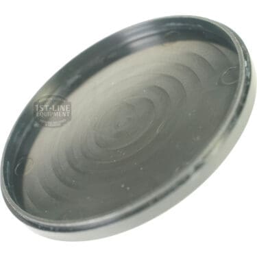 A close-up of the Pinecone PIN90001 Bean Hopper Lid, round and black with subtle circular ridges, made of plastic or metal and viewed at an angle with a slightly worn surface. © 2025 1st-line.com