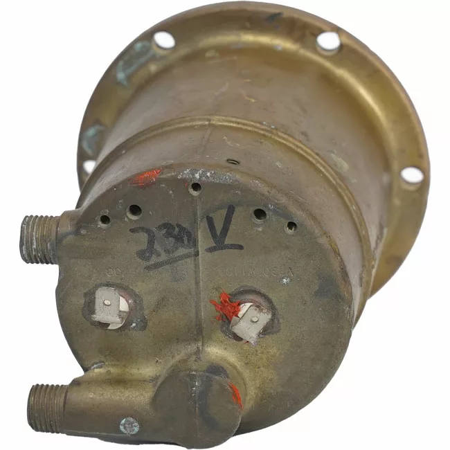 A close-up of the Rancilio 20102944 230V Boiler with Welded Element, featuring two threaded connectors, electrical terminals, handwritten markings, and red paint on its vintage brass surface. © 2025 1st-line.com