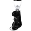 A sleek black Fiorenzato F83 E XGi Espresso Coffee Grinder features a transparent bean hopper, digital display, control buttons, and a metal portafilter holder, all elegantly positioned on a circular drip tray. © 2025 1st-line.com