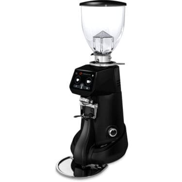 A sleek black Fiorenzato F83 E XGi Espresso Coffee Grinder features a transparent bean hopper, digital display, control buttons, and a metal portafilter holder, all elegantly positioned on a circular drip tray. © 2025 1st-line.com