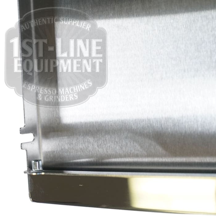 Close-up of a stainless steel tray reflecting part of the 1st-Line Equipment logo. Its stylish design matches any espresso setup and pairs perfectly with the Torre T02POS001 Back Panel - Stainless Steel. © 2025 1st-line.com