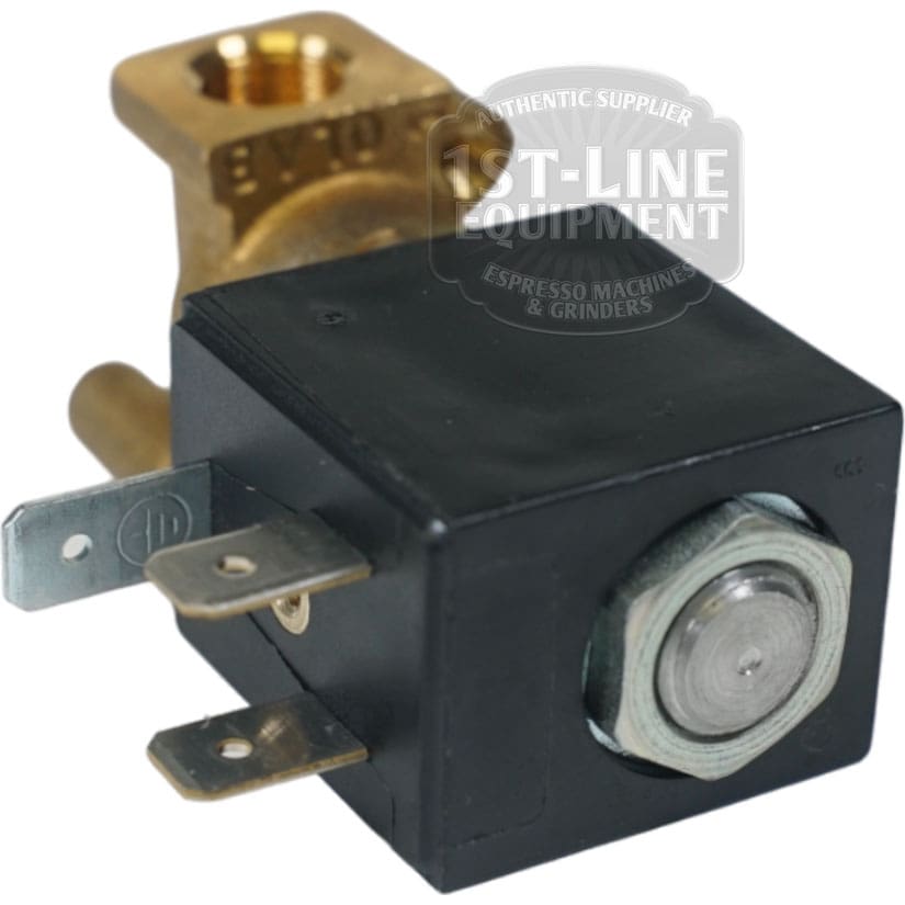 Close-up of a Torre EV212001 Solenoid Valve EV. 2 VIE 1/8 110V in brass and black with electrical terminals, commonly used in espresso machines. The faint 1st-Line Equipment branding is visible in the background. © 2025 1st-line.com