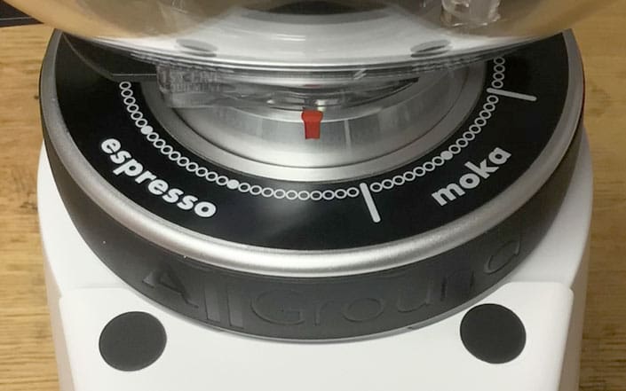 Close-up of the Fiorenzato AllGround Coffee Grinder - Time-Based Grinding adjustment dial, highlighting espresso and moka settings with a red indicator. The AllGround branding appears on the front of the grinder. © 2025 1st-line.com