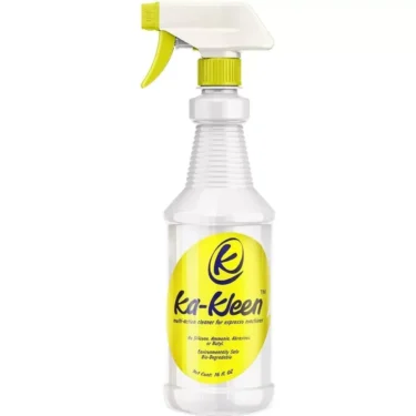 The 16oz Ka-Kleen Multi-Action Cleaner comes in a clear spray bottle with a yellow and white nozzle and a yellow label with blue text, and is specially formulated for powerful cleaning of espresso machines. © 2025 1st-line.com