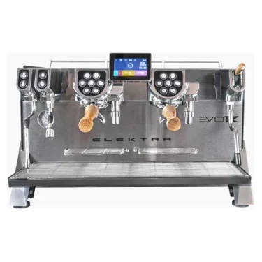 The Elektra Evok 2 Group Commercial Espresso Machine features a stainless steel body, two group heads with wooden handles, a central touchscreen, multiple control buttons, and EVO model branding on the front. © 2025 1st-line.com