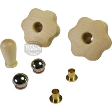 The Lelit PLA2203 Maple Wood Steam / Hot Water Knob Kit, including two flower-edged wooden knobs, a maple wood handle, two metal balls with red rings, and two small brass fittings, is arranged on a white background. © 2025 1st-line.com