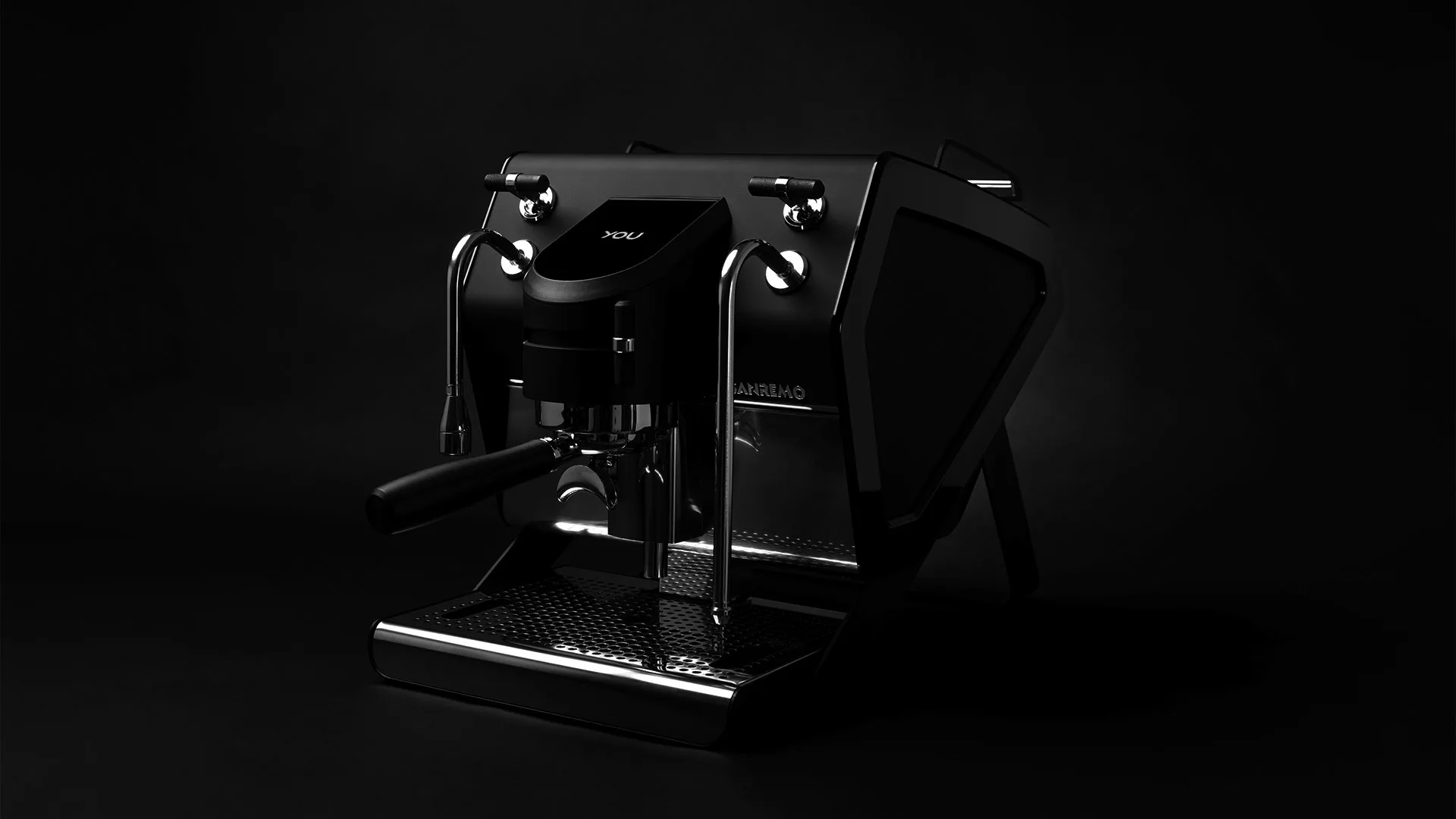 The Sanremo YOU Dual Boiler Espresso Machine, featuring a sleek modern design with metallic accents, is showcased on a dark surface against a black background, its angular details illuminated for emphasis. © 2025 1st-line.com