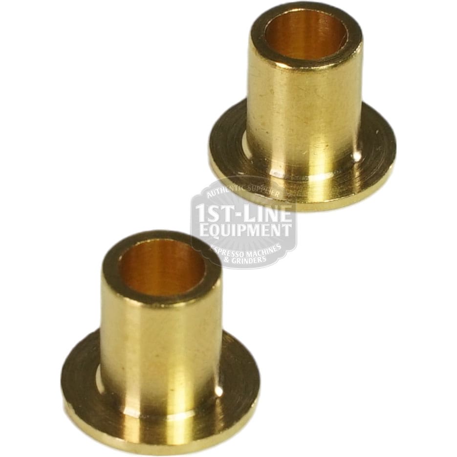 Two small flanged brass bushings with hollow centers, designed for the Lelit PLA2203 Maple Wood Steam / Hot Water Knob Kit. They have a cylindrical shape and are shown on a white background. © 2025 1st-line.com