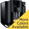 The Jura E4 Super-Automatic Espresso Machine in black is shown with a cup of coffee on a yellow background, featuring the bold message “More Colors Available.”. © 2025 1st-line.com