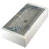 The Torre KITT02BACBI White Drip Tray Kit is a rectangular tray with a grid-patterned metal cover, protective blue film partially removed, revealing vents and a circular sensor or button beneath. © 2025 1st-line.com