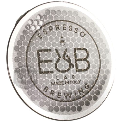 The V317K Puck Screen Diffuser by E&B Lab is a circular espresso filter basket featuring a honeycomb pattern and ESPRESSO E&B LAB BREWING MADE IN ITALY in the center, with a metallic surface that reflects light. © 2025 1st-line.com