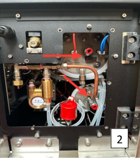 Inside an ACS Vesuvius Evo Leva machine panel with various metal pipes, valves, and tubes; two red arrows highlight draining boilers connections; a red cap and several wires are visible; the number 2 appears in the bottom right corner. © 2025 1st-line.com