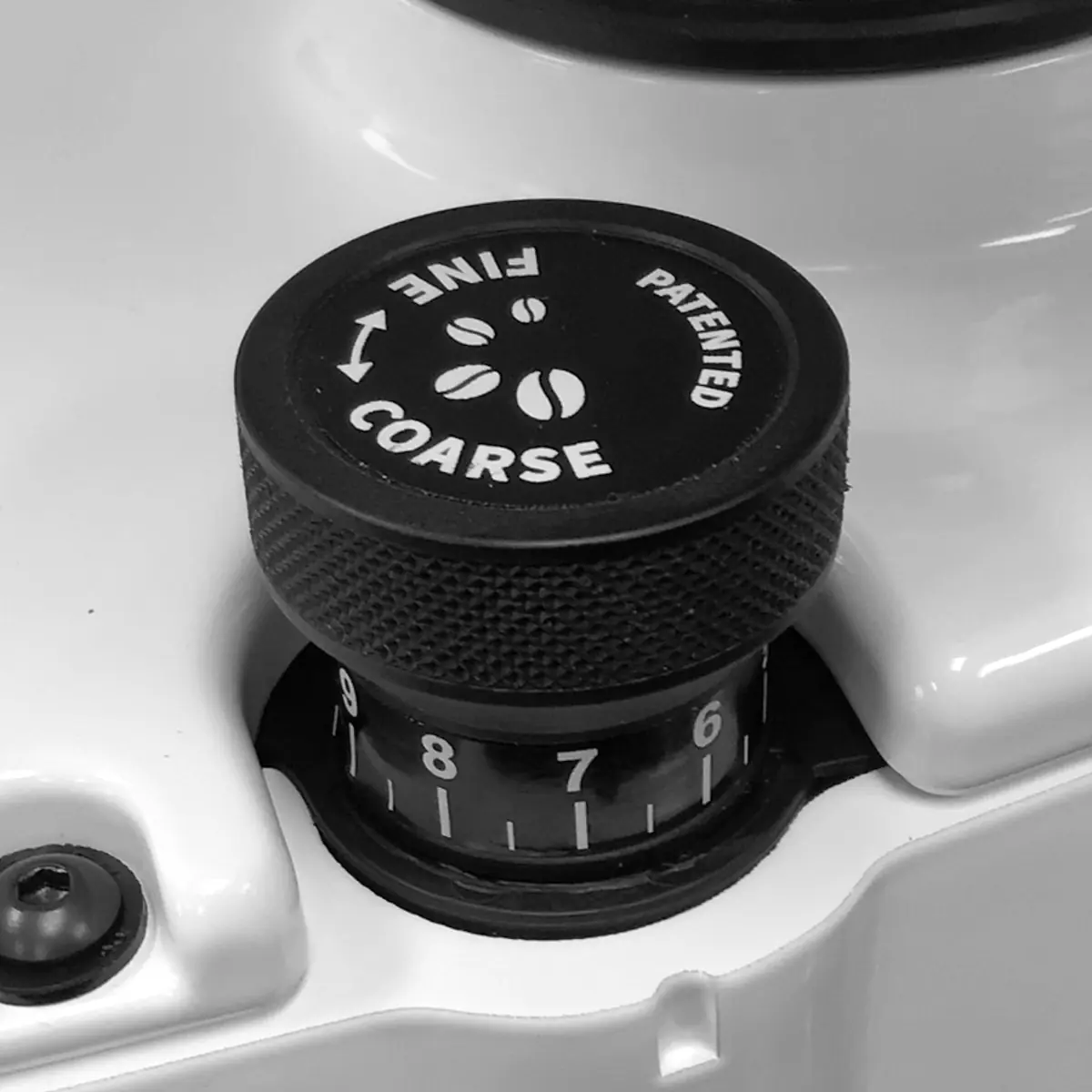 Close-up of the Eureka Atom W 65 Weight Based Espresso Coffee Grinder’s adjustment knob, labeled PATENTED, with grind settings from 1 to 10, fine and coarse icons, and coffee bean graphics—ideal for dialing in your perfect espresso. © 2025 1st-line.com