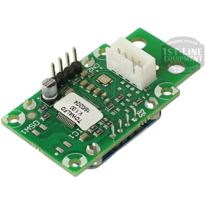 A green electronic circuit board module, the Torre DISP0004 Display for Alfredo and Luigino TSP Gicar 8.8.75.13G, with a white connector, black pins, and surface-mounted chips is shown on a white background. © 2025 1st-line.com