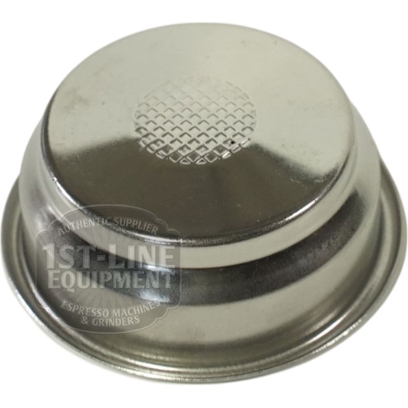 A Lelit 1600071 Pressurized Filter 58mm is shown upside down, displaying a central grid of holes and the partially visible 1st-Line Equipment logo on its metal side. © 2025 1st-line.com