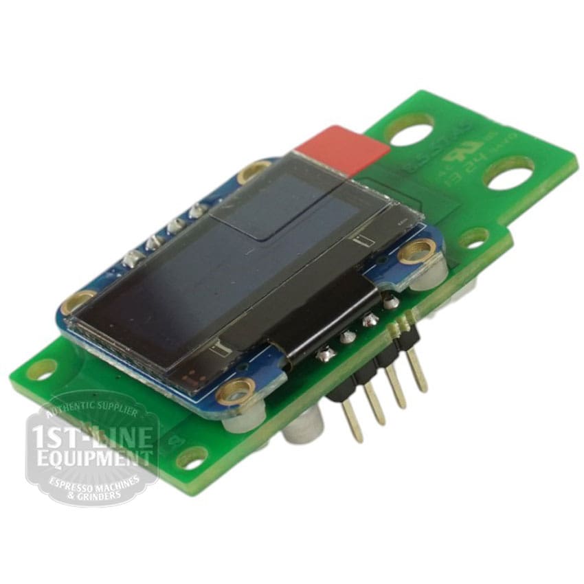 A small green circuit board featuring a mounted rectangular black Torre DISP0004 Display for Alfredo and Luigino TSP Gicar 8.8.75.13G, several metal pins, and a red component, photographed at an angle on a white background. © 2025 1st-line.com