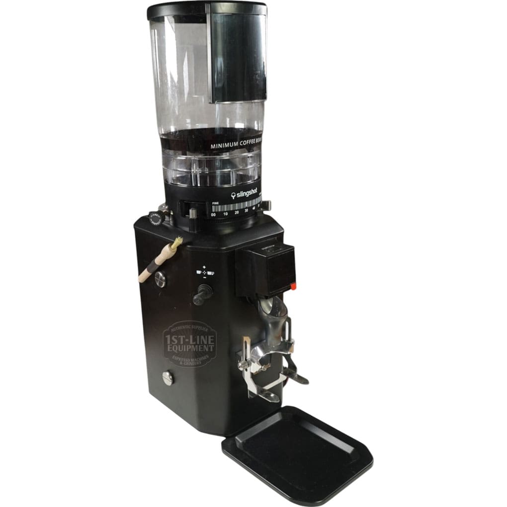 The CONVENTION DEMO - Slingshot Talis S75 Espresso Coffee Grinder Black 220V (C203) includes a transparent bean hopper, control panel, metal portafilter holder at the front, and a small tray for catching ground coffee. © 2025 1st-line.com