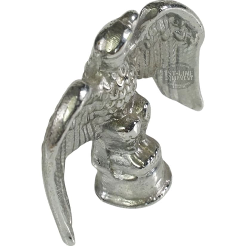 The Elektra 00658021 Chrome Eagle for Mini Verticale (A1C chrome) is a metal figurine with outstretched wings, perched on a round base and seen from above. © 2025 1st-line.com