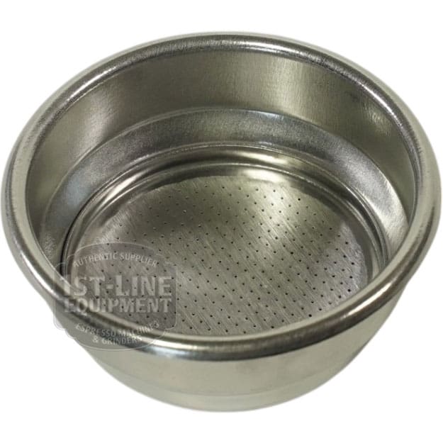 The Lelit 1600071 Pressurized Filter 58mm is a stainless steel basket with small holes at the bottom, designed to hold coffee grounds for espresso machines. © 2025 1st-line.com