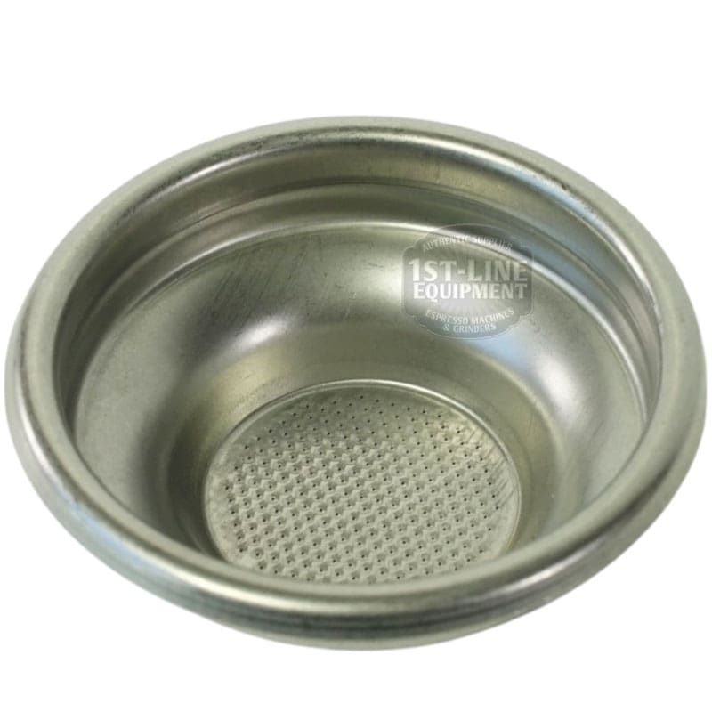 The Torre FILT0005 1-cup Filter Basket is a metal basket with a perforated base, designed to hold ground coffee during brewing. It has a slightly reflective surface and is shown against a plain background. © 2025 1st-line.com
