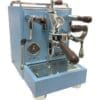 The Torre Luigino blue espresso machine features chrome and wooden handles, pressure gauges, flow control, and a metal drip tray—perfectly designed for crafting specialty coffee drinks. © 2025 1st-line.com