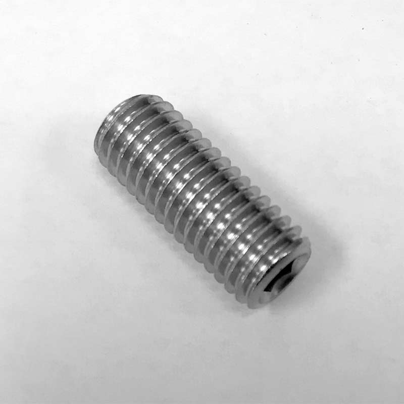 A close-up of a Bellezza Bellona metal threaded rod or set screw lying on a white surface. The cylindrical screw, with evenly spaced threads and no visible head, ensures the right fit for precise applications. © 2025 1st-line.com