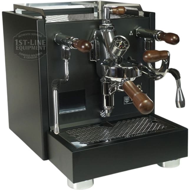 A sleek, black Torre Peppina EVO Premium V2 Dual Boiler Espresso Machine w/ FC, featuring wooden handles, chrome accents, a gauge, and multiple nozzles, sits on a counter with a drip tray beneath. © 2025 1st-line.com