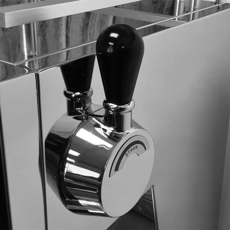 Close-up of a shiny, metallic lever with a black handle labeled steam, reflected in a mirror-like surface—possibly part of the Bellezza Bellona coffee machine—showcasing the right fit for precision and style. © 2025 1st-line.com