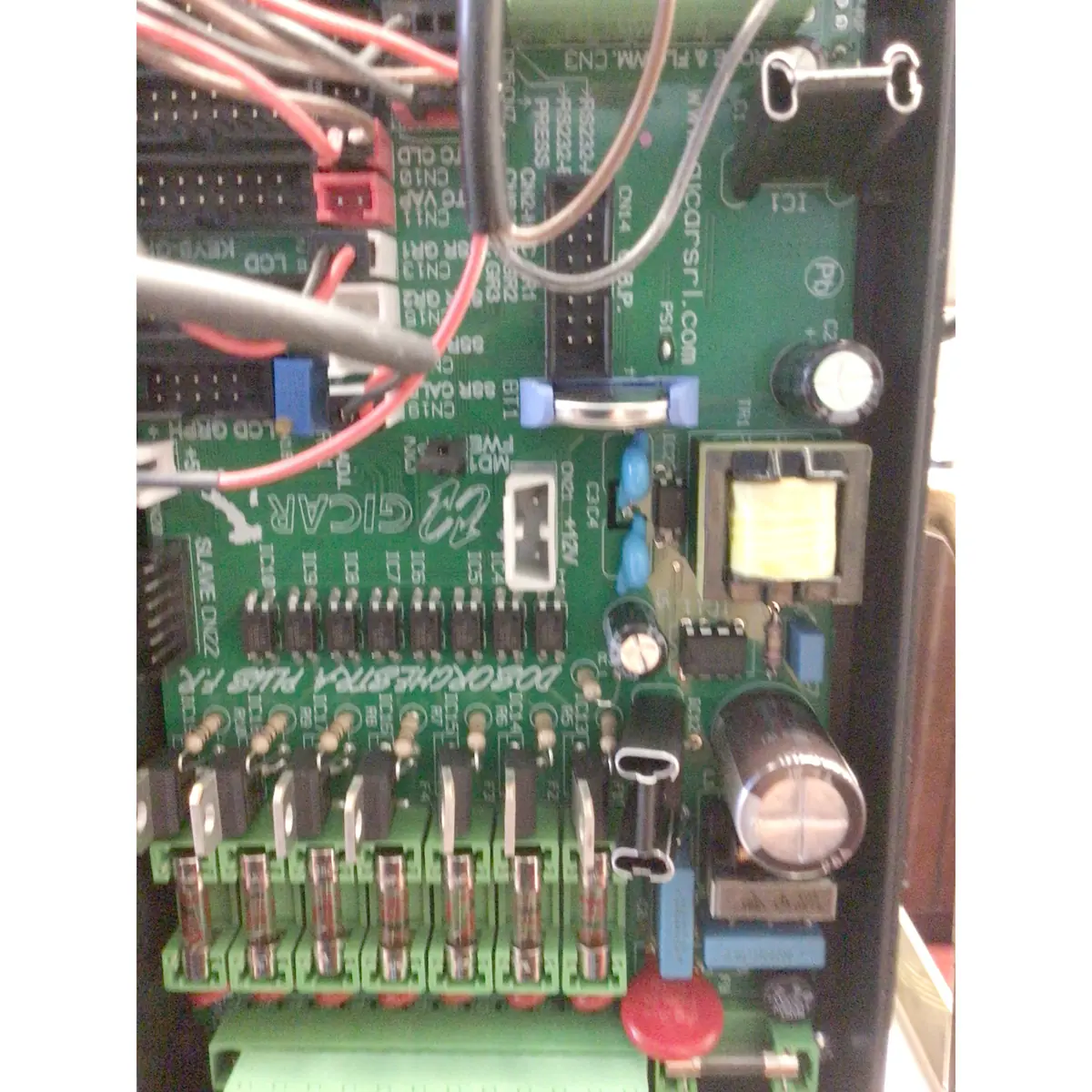 Close-up of an electronic circuit board from the Torre Peppina EVO Premium V2 Dual Boiler Espresso Machine w/ FC, labeled CIGAR and POWERMASTER-MK5, showing green fuses, wires, capacitors, connectors, and EVO Premium V2 components.